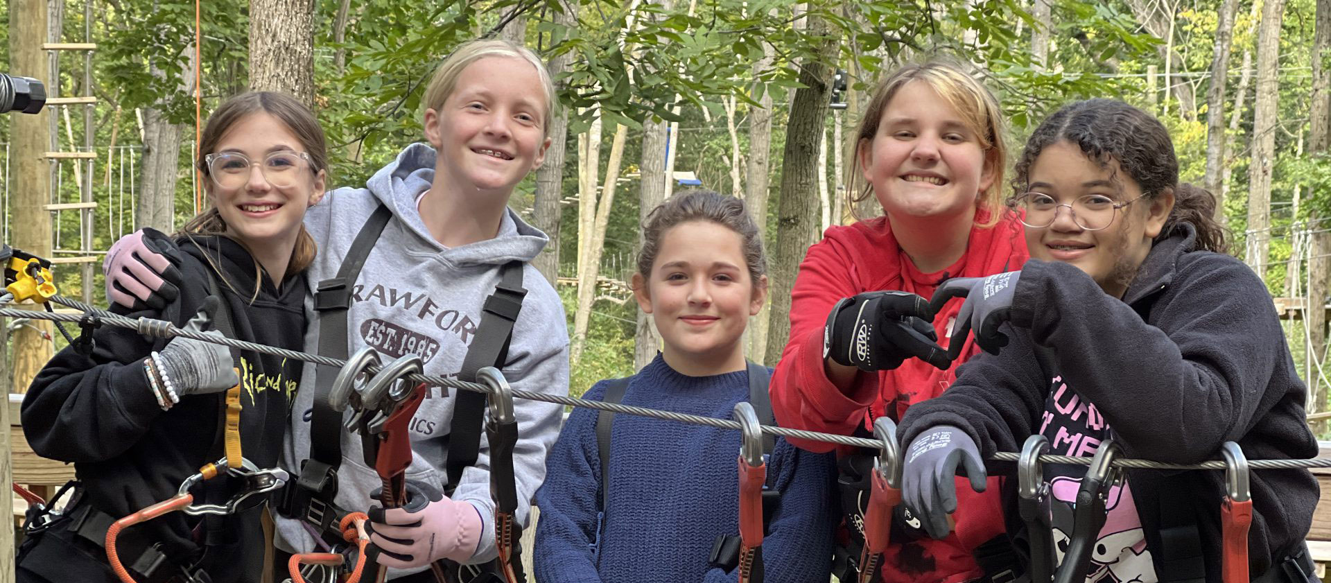 Five girls using the ropes course