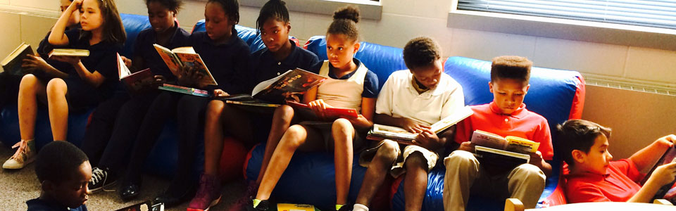 A group of students reading in the library.