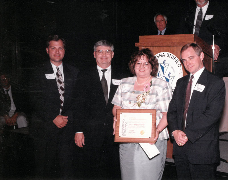 Luz C. Rodruiguez-Alvino with award presenters.