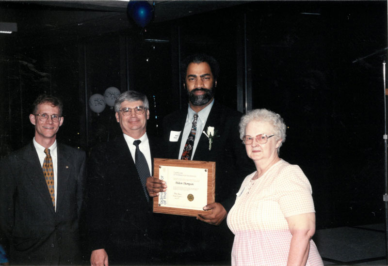 Milton Thompson with award presenters.