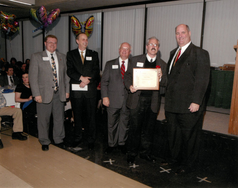 Daniel Tenuta with award presenters.