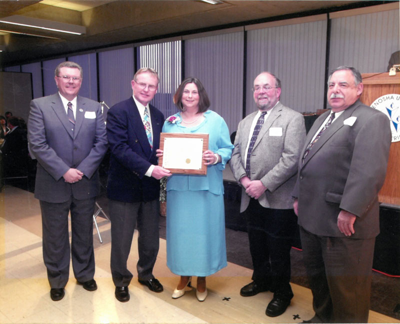 Kathleen M. Barca with award presenters.