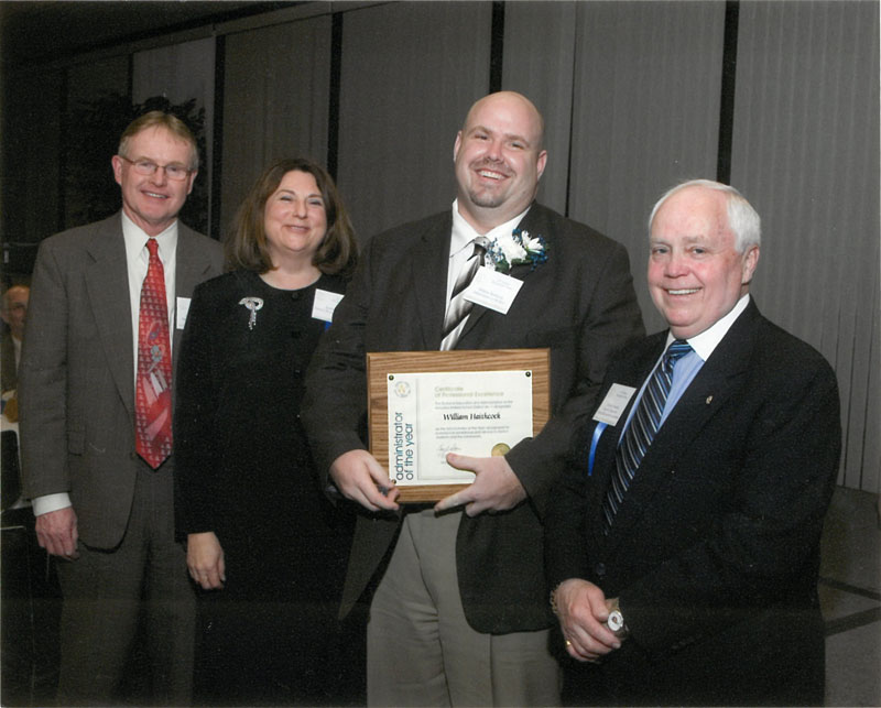 William Haithcock with award presenters.