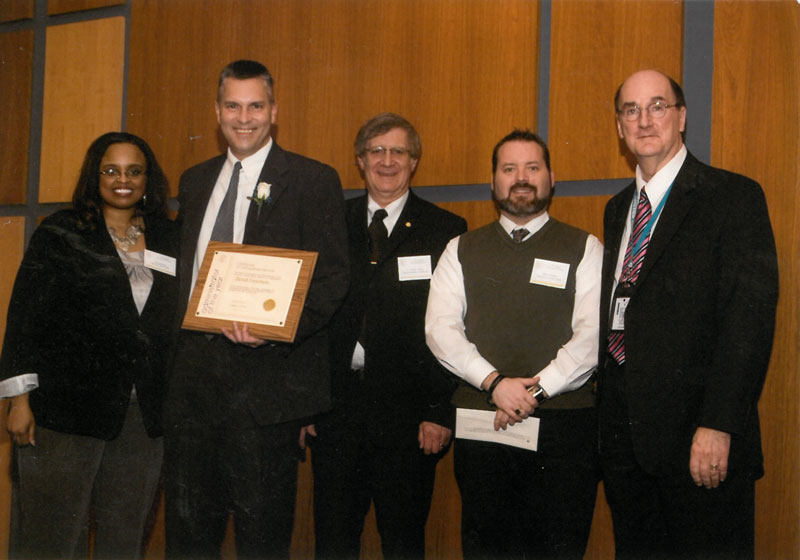 Patrick Finnemore with award presenters.