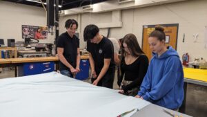 Key Club - Working on tie blankets to donate to Urban Outreach.