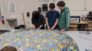 Key Club - Working on tie blankets to donate to Urban Outreach.