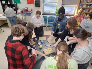 National Honor Society decorating cookies to donate to the Shalom Center