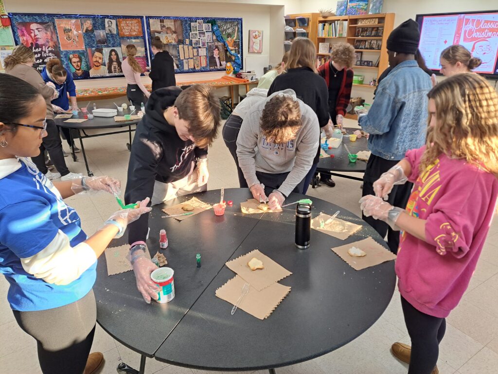 National Honor Society decorating cookies to donate to the Shalom Center