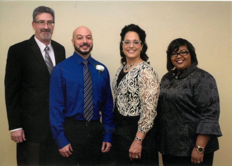 Tarik Hamdan with award presenters.