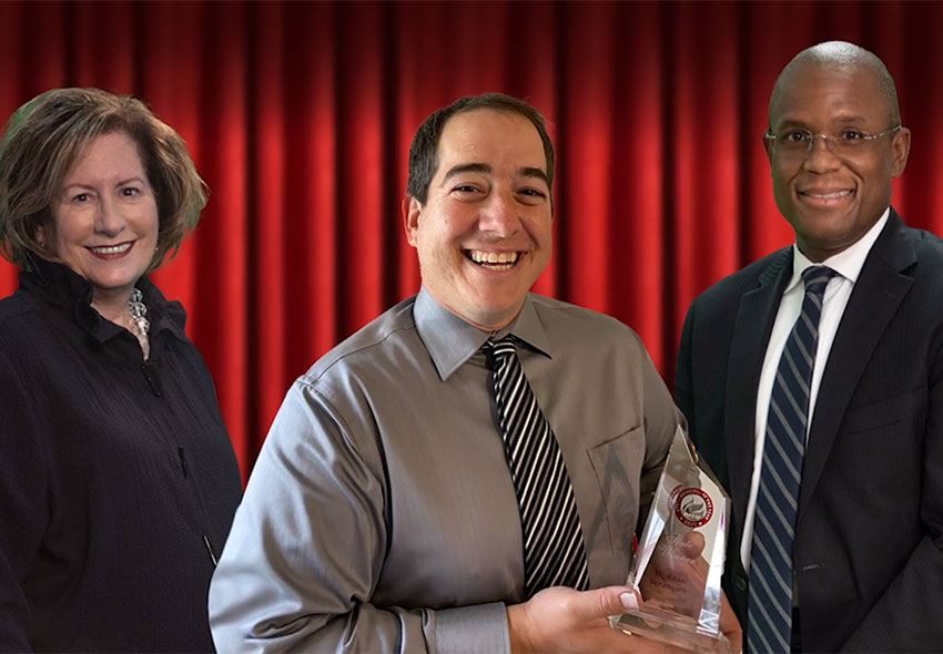 Dr. Benzaquen holding his award.