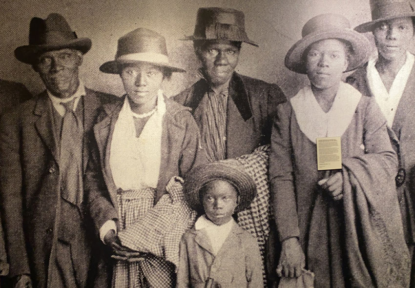 A museum exhibit showing a family of five.