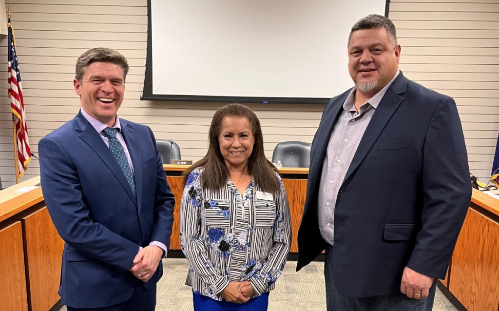 Dr. Weiss, Yolanda Adams, and a Potawatomi member posing in the boardroom