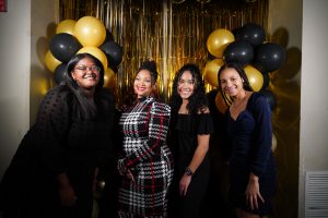 Four young women posing at the gala.