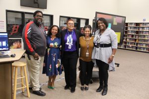 Group photo of Deanna Singh with four KUSD staff members.