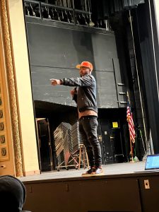 Jacarrie Carr speaking to students in the Reuther auditorium.