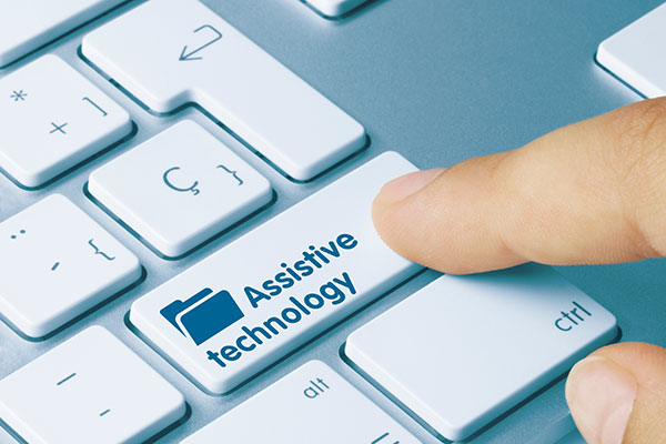 Photo of a keyboard with a key that says Assistive Technology
