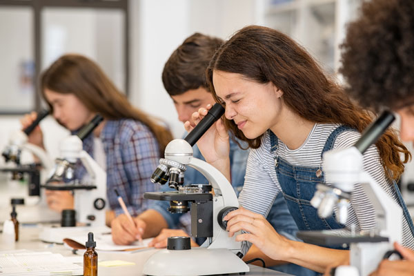 Students using microscopes.